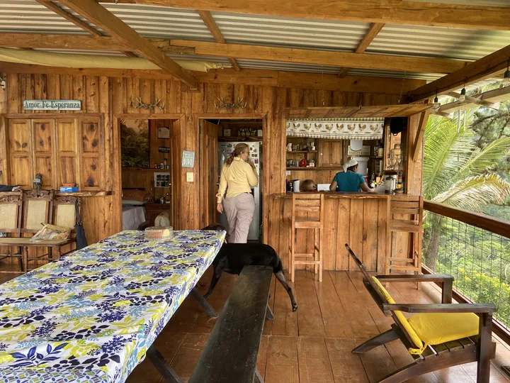 The wooden farmhouse kitchen and dining table at Finca Montealegre